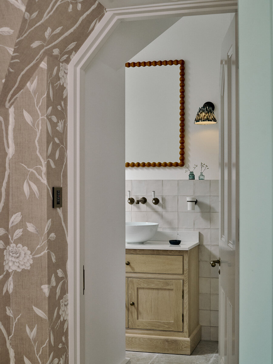 look through bedroom into bathroom sink with custom sink and mirror