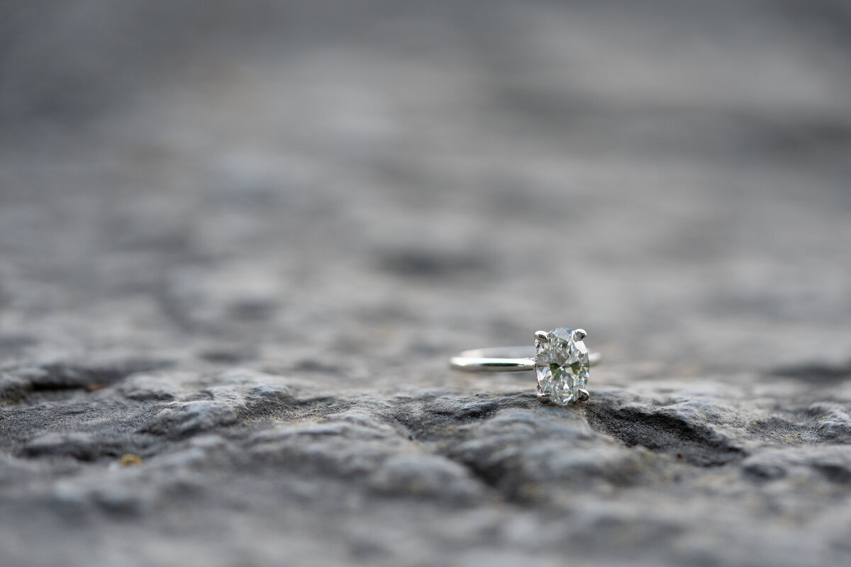 An engagement ring on a rock