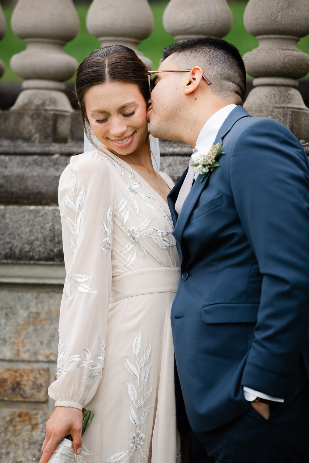 groom kiss bride on cheek at Aldrich Mansion