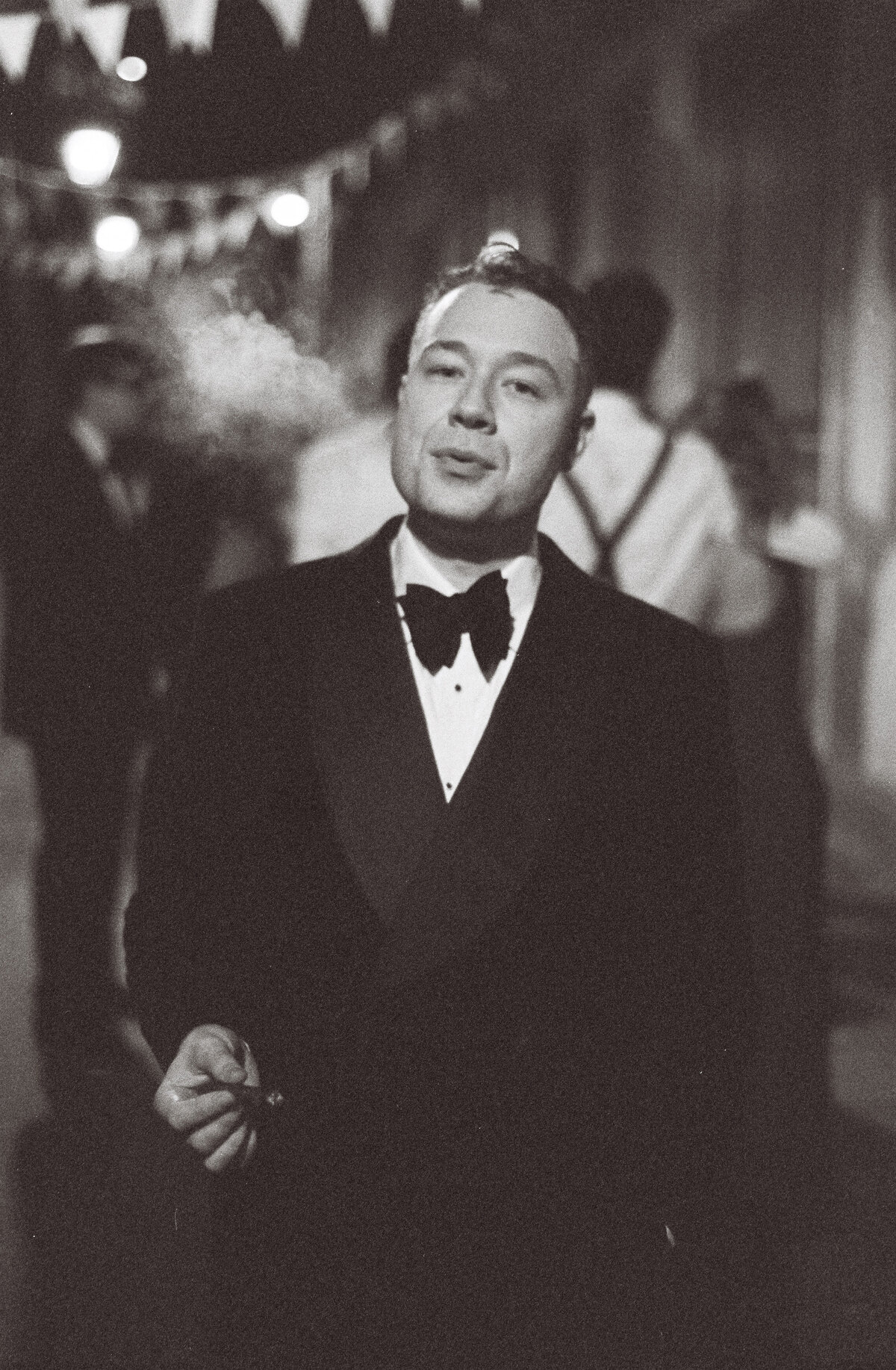 Black tie groom portrait at Wilton’s Music Hall wedding, photographed on analogue film – The Falkenburgs Studio UK wedding photography