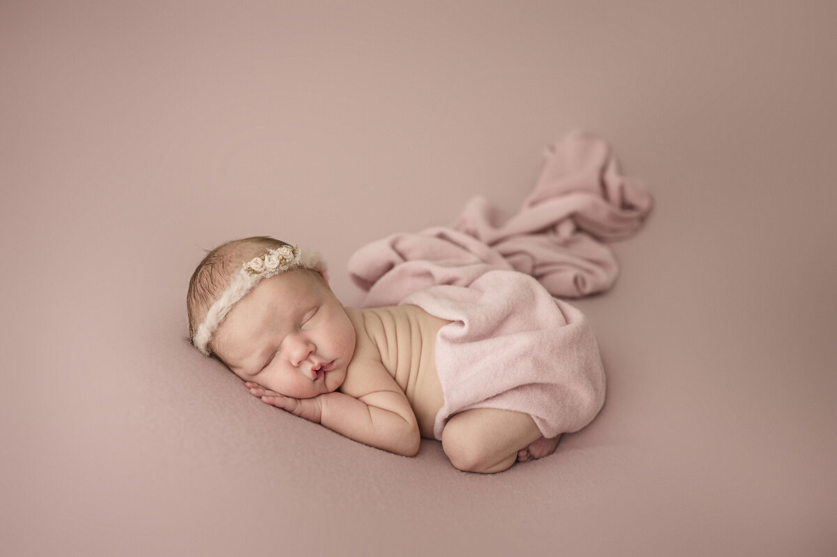 newborn girl on pink backdrop pittsburgh studio