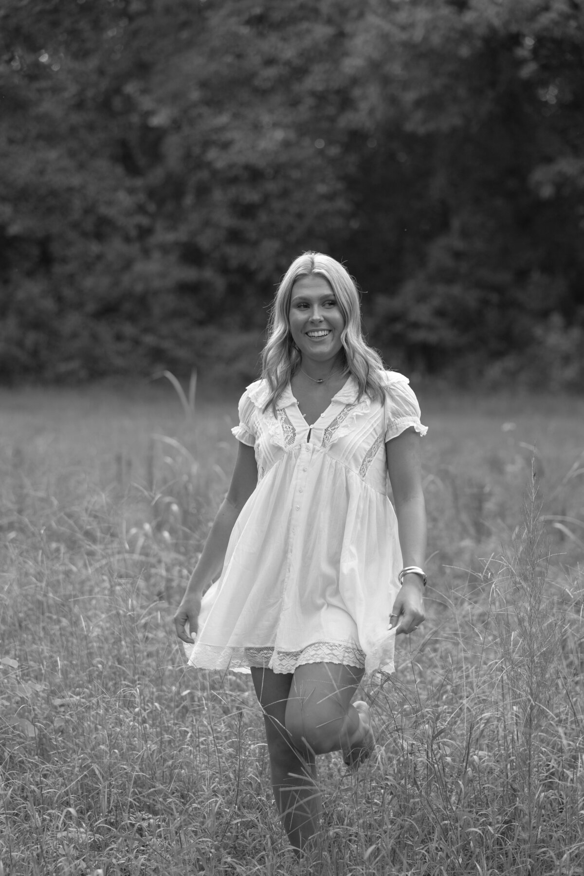 Senior photos in a field of tall grass