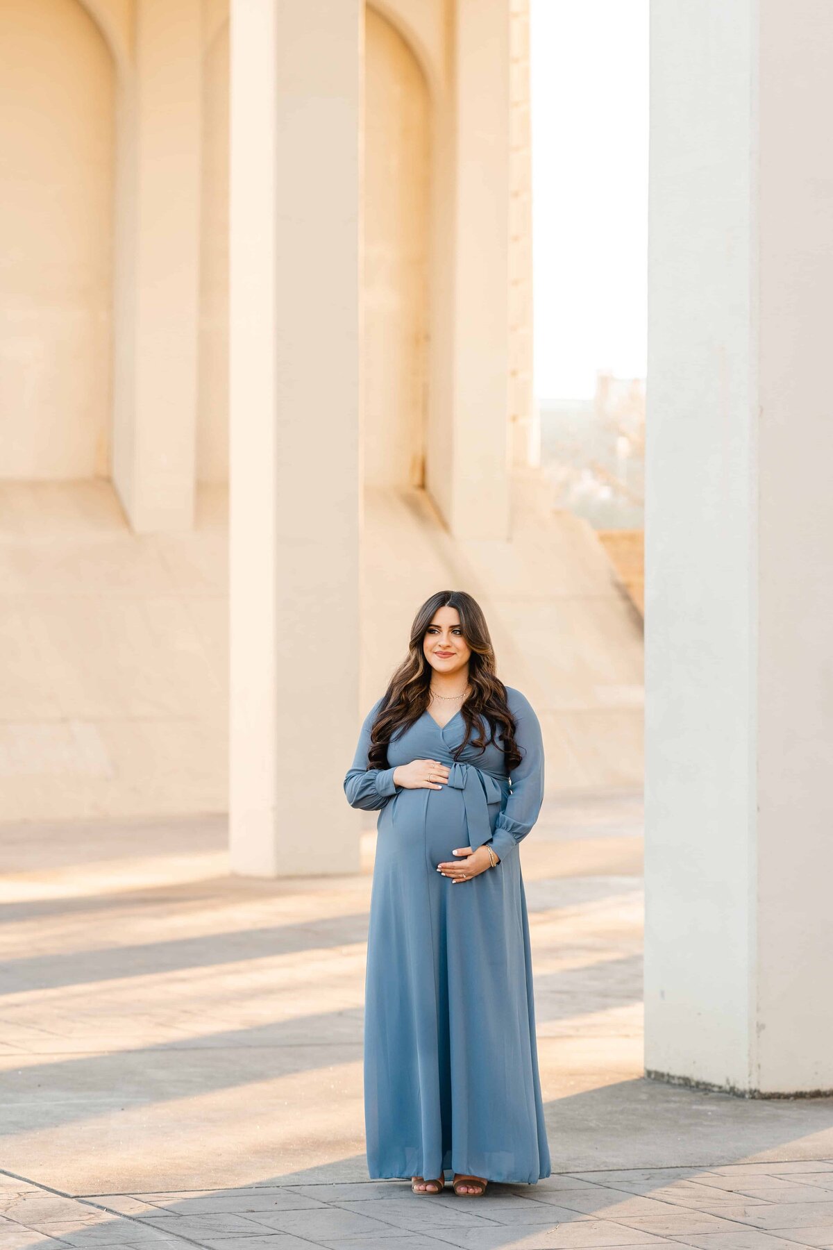 Chattanooga maternity photographer captures mother in blue gown at Coolidge Park