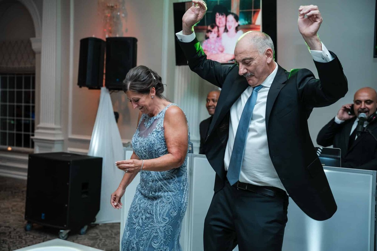 Parents of the groom dancing at the reception Palm Beach Wedding photographers