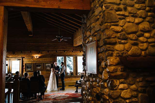 Wedding ceremony at President's Room, Emerald Lake Lodge, rustic and classic Field, British Columbia wedding venue, featured on the Brontë Bride Vendor Guide.