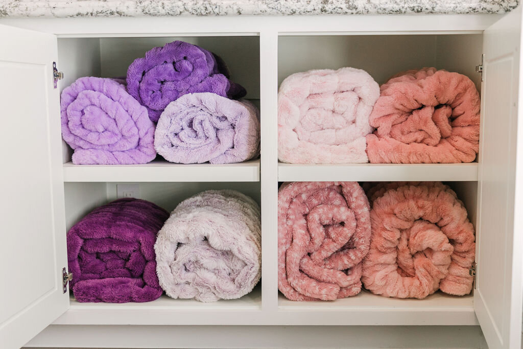Soft Minky blankets organized in cabinets
