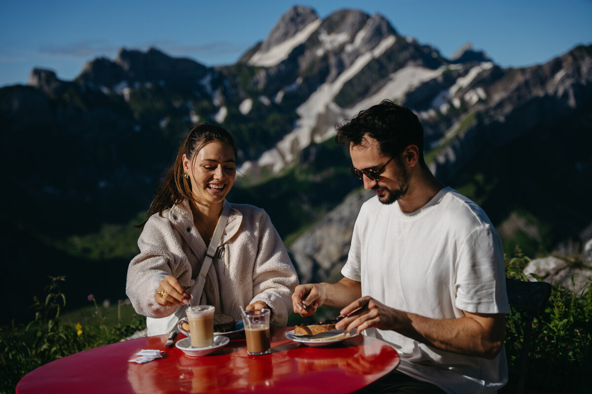 Couple enjoying breakfast at their rifugio in Switzerland