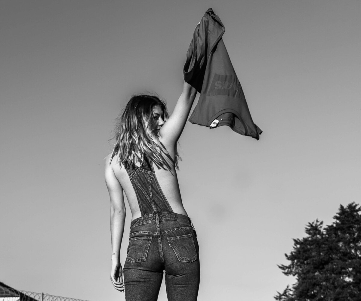 Greyscale Photography of Woman with a T-Shirt in Hand