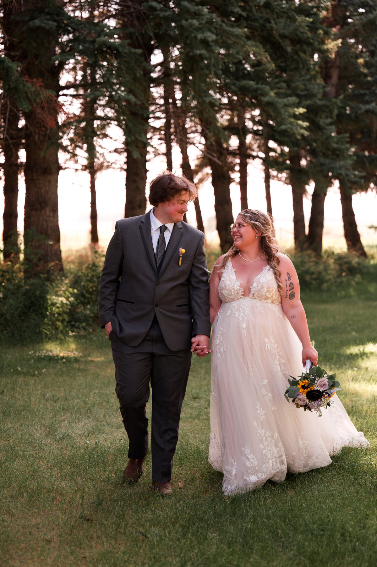 Edmonton wedding portrait of a bride and groom walking and smiling