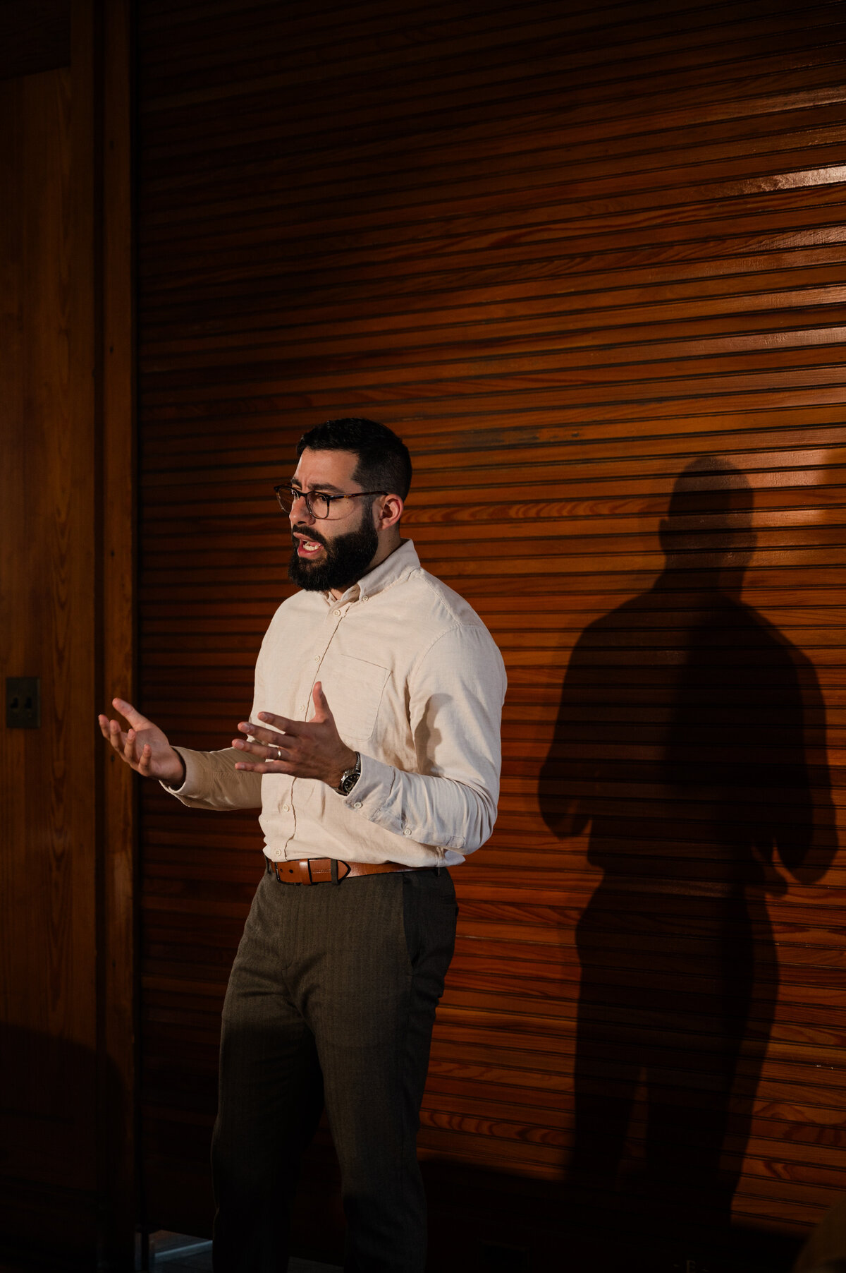 Nico Misleh in an auditorium setting, embodying the blend of modern medicine and classic learning