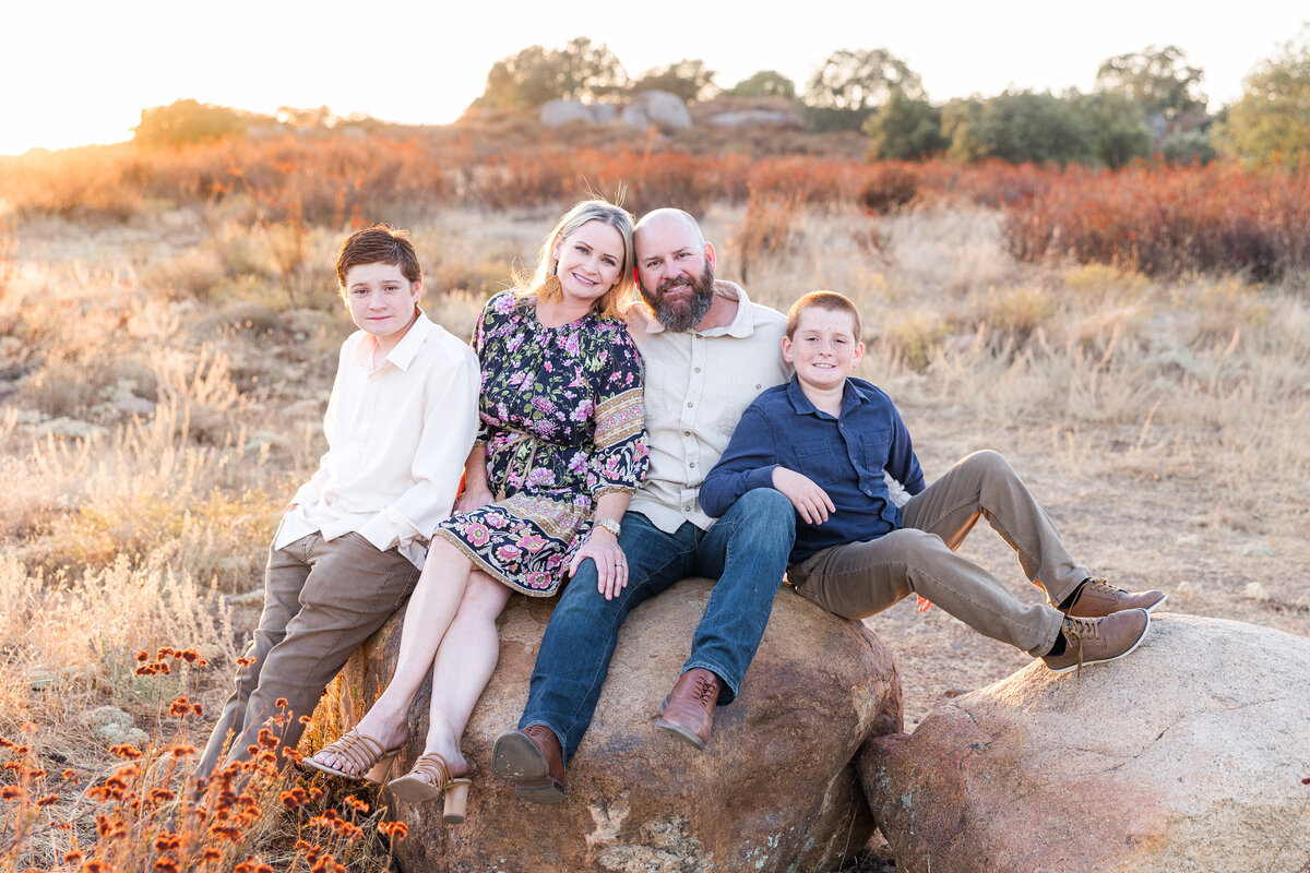 wrights field san diego family sitting on rock