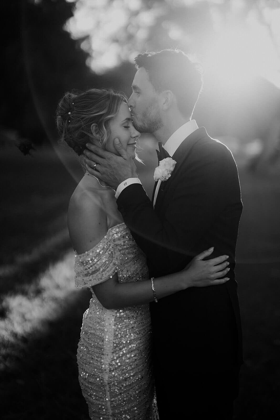 Bride and Groom kissing in black and white
