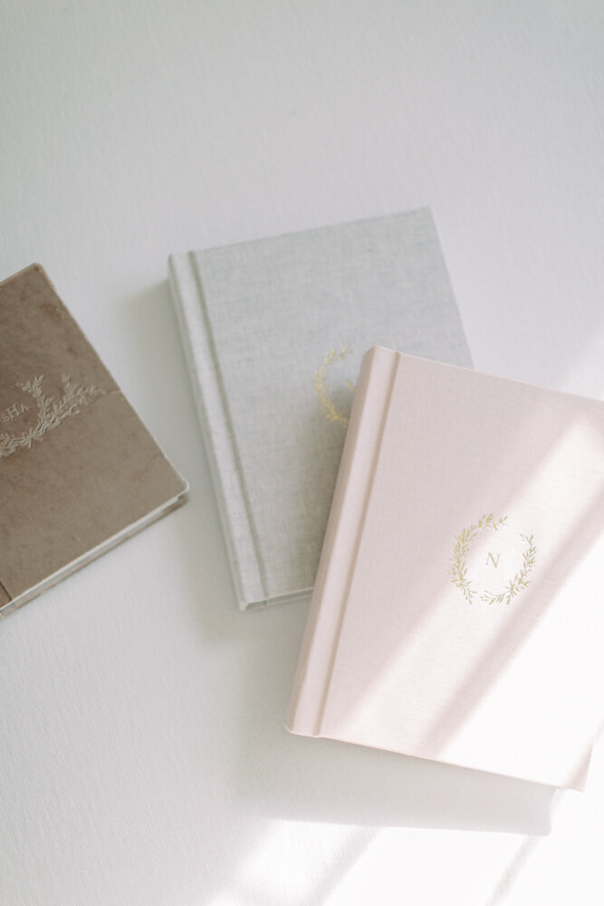 photo of a beautiful linen album with glass box of photo prints made by Milwaukee photographer, Talia Laird Photography