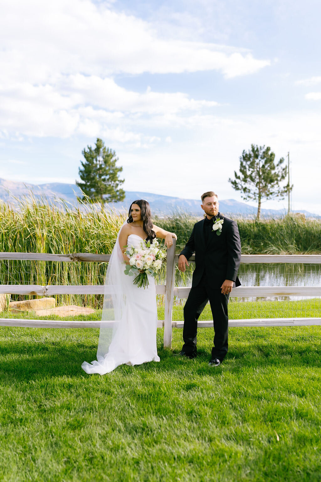 Couple on the lawn with mountains behind