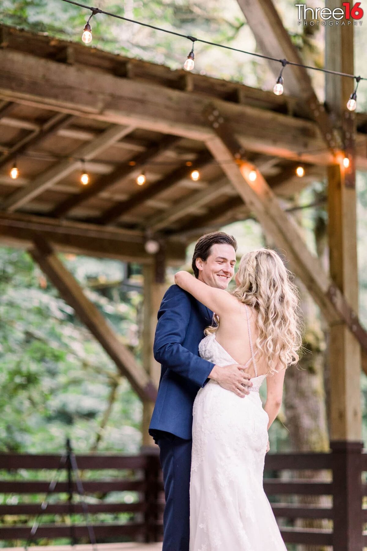 Groom smiles at his Bride during their first dance