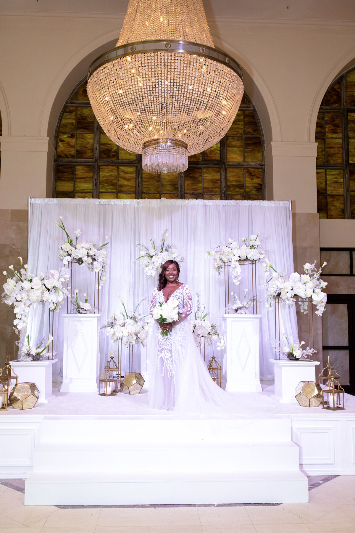 southern-exchange-ballroom-atlanta-ga-wedding-couple-walking-down-aisle-cheering-guests