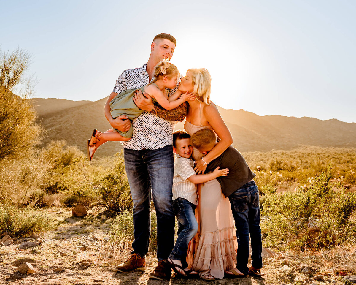 arizona family hugging and playing during photo session in AZ