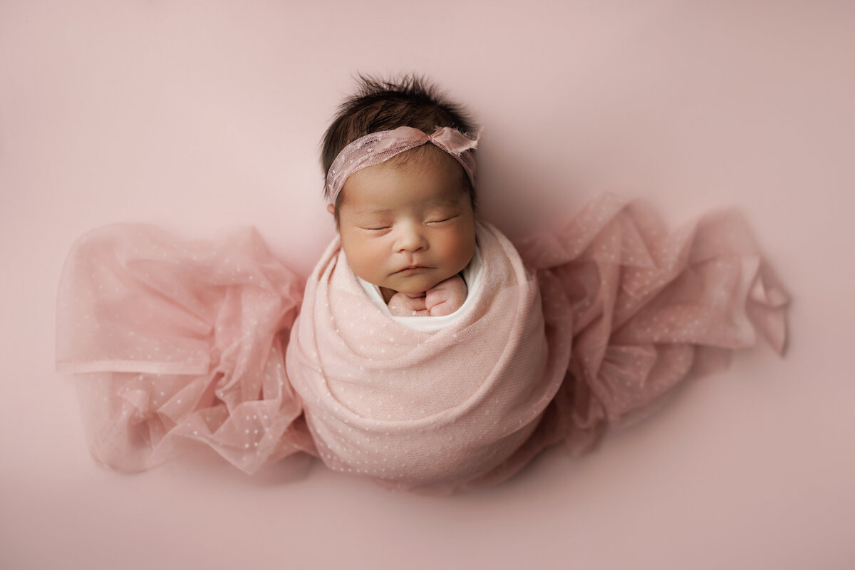 Pink newborn baby portrait in Denver