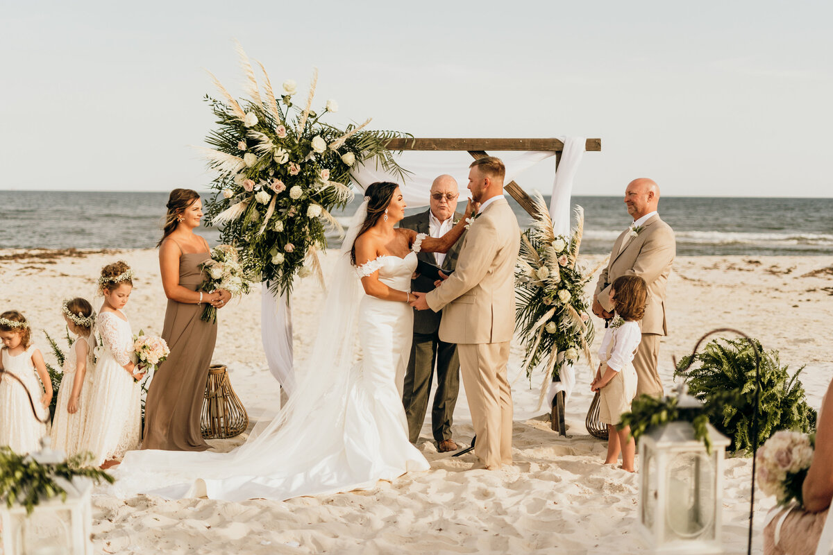 bride and groom wed on beach