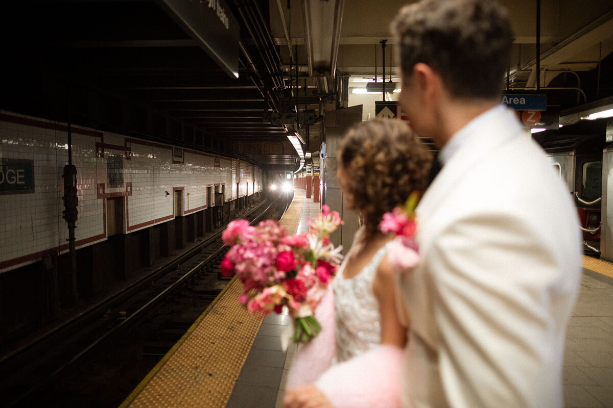 nyc vintage city hall elopement couple with happy isles dress and pink bloom bloom bouquet
