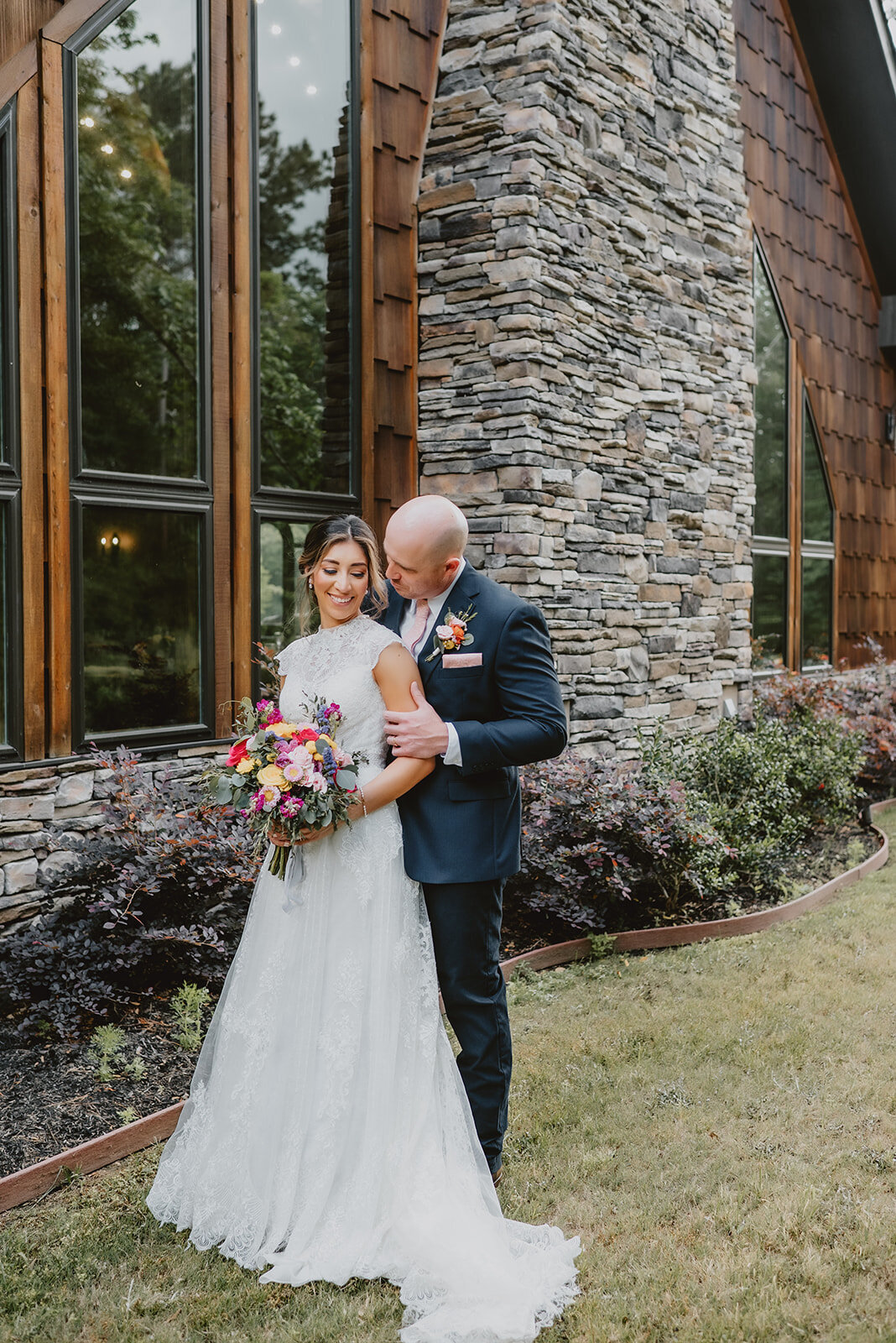 Couple in a Lodge Like Wedding Venue