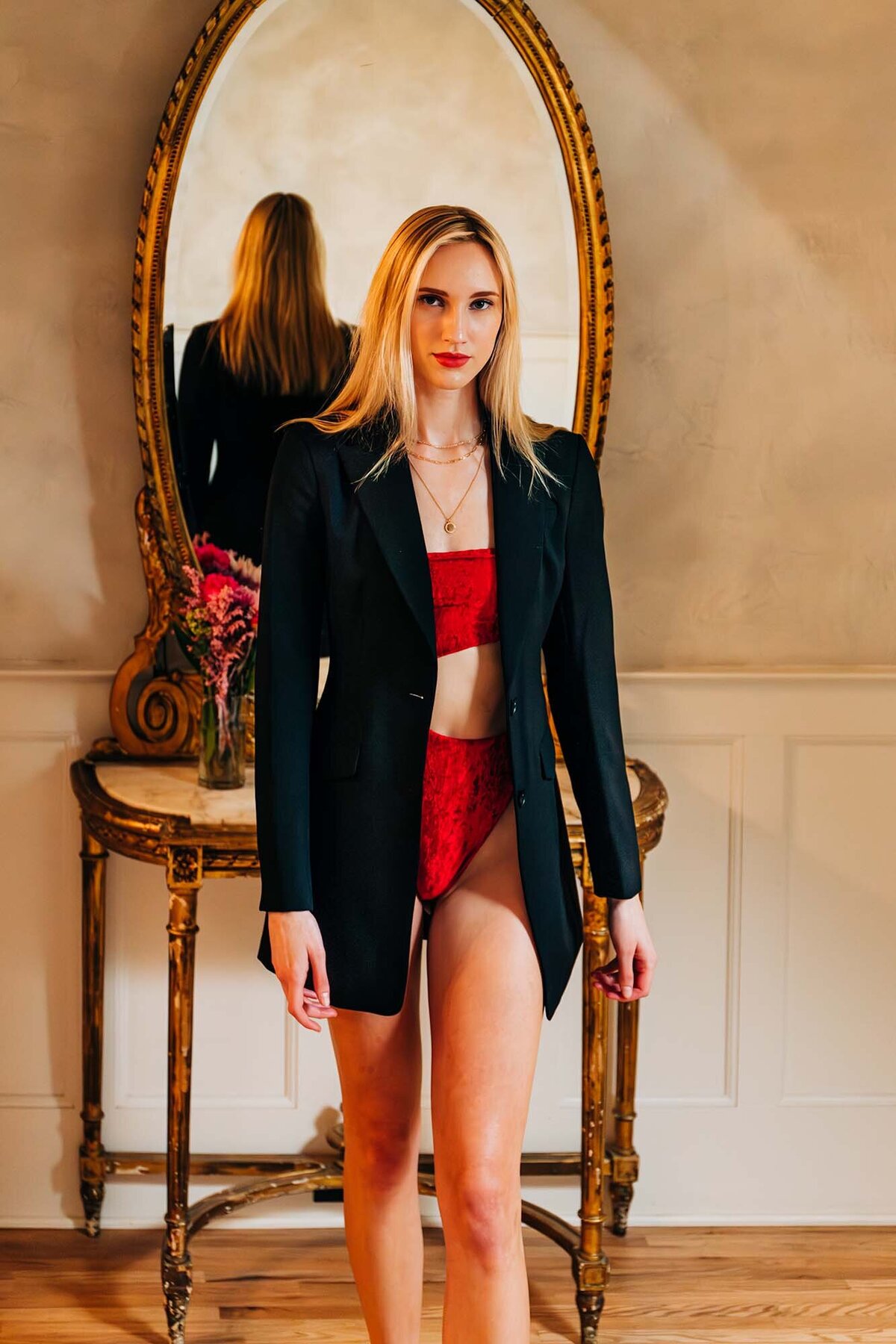 Montana model in red swimsuit and black blazer