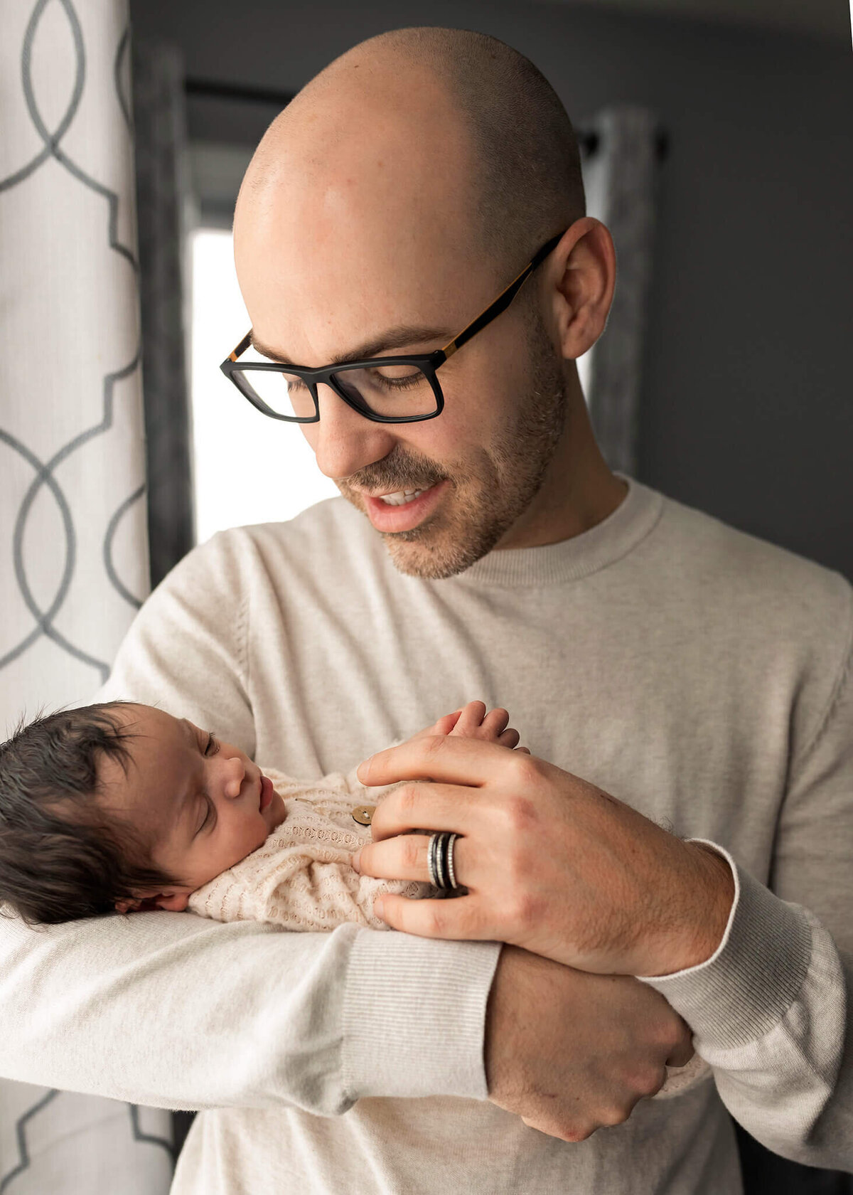 NJ Newborn photography session with  dad holding his baby close