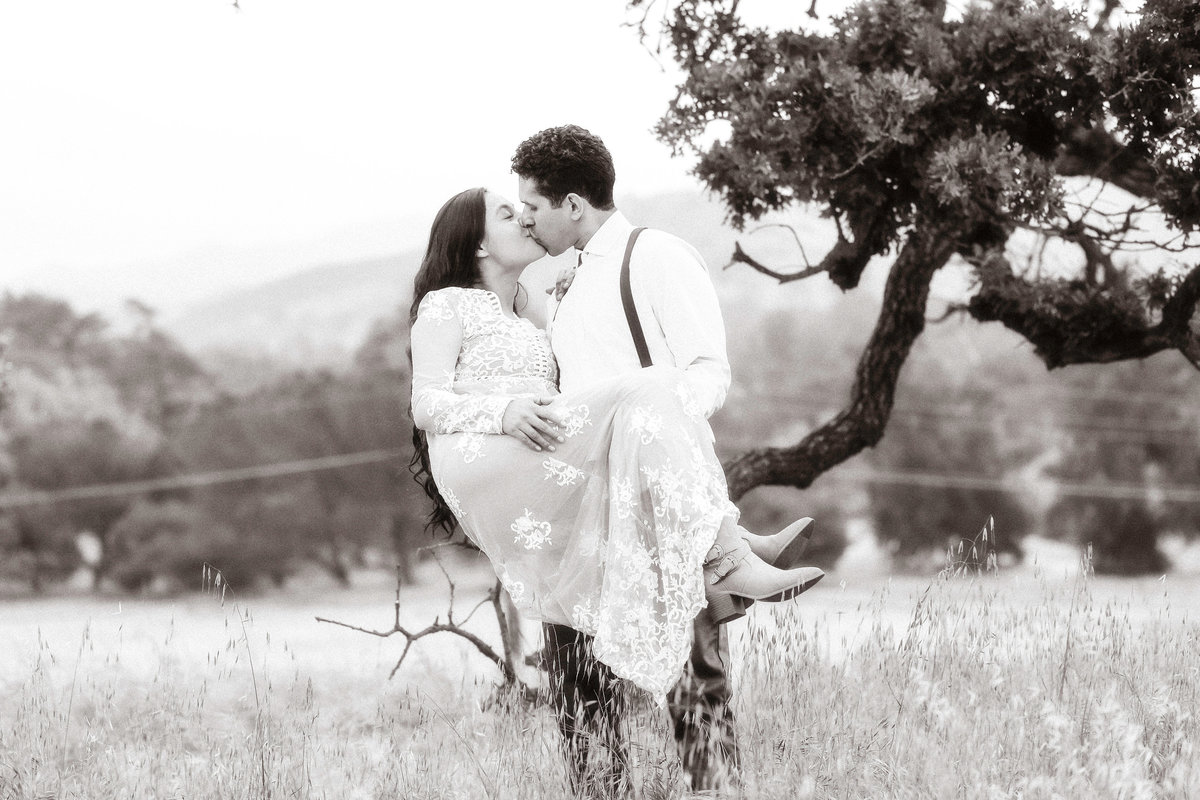 Engagement Photograph Of Man Carrying And Kissing a Woman Black And White Los Angeles