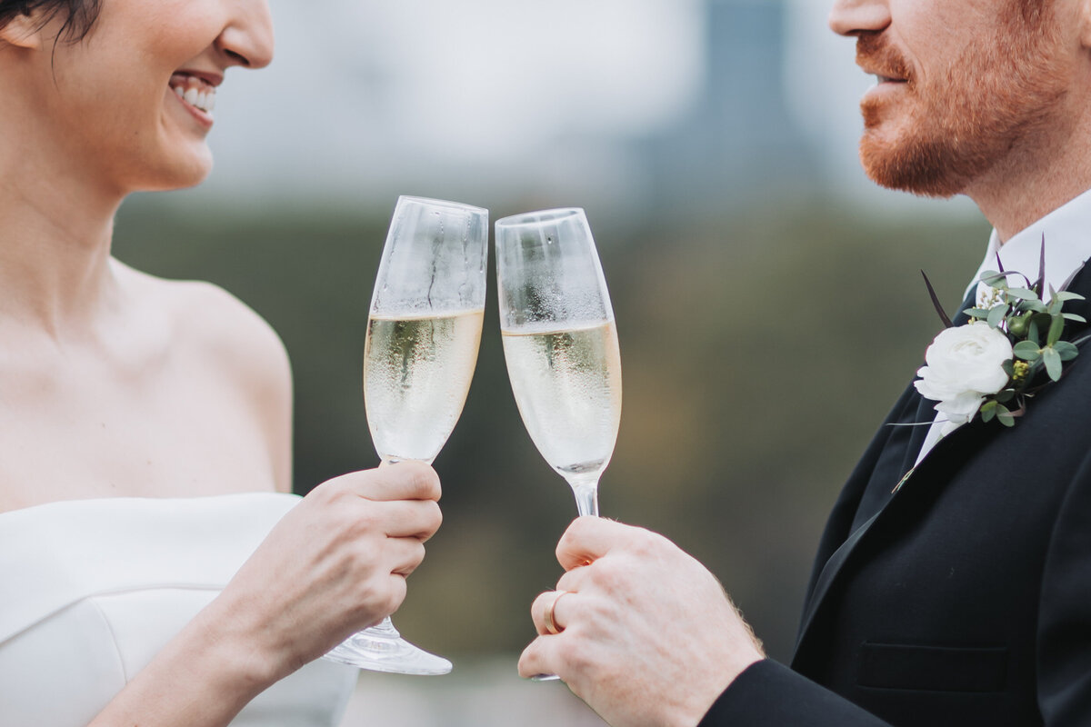 bride and groom toasting with champagne