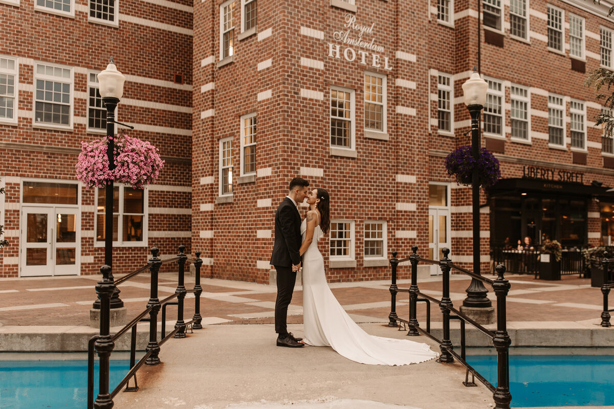 bride and groom on a bridge in iowa