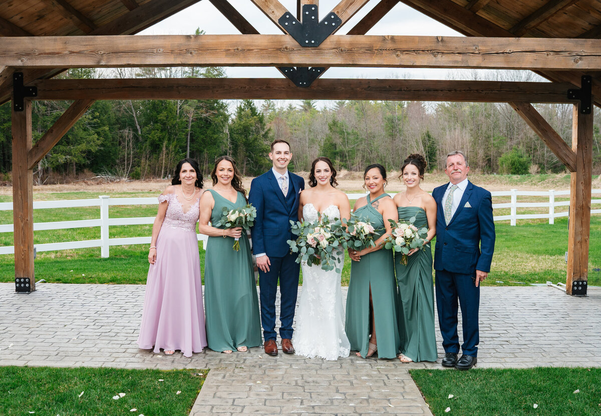 Elegant wedding flat lay with rings, florals, and invitations