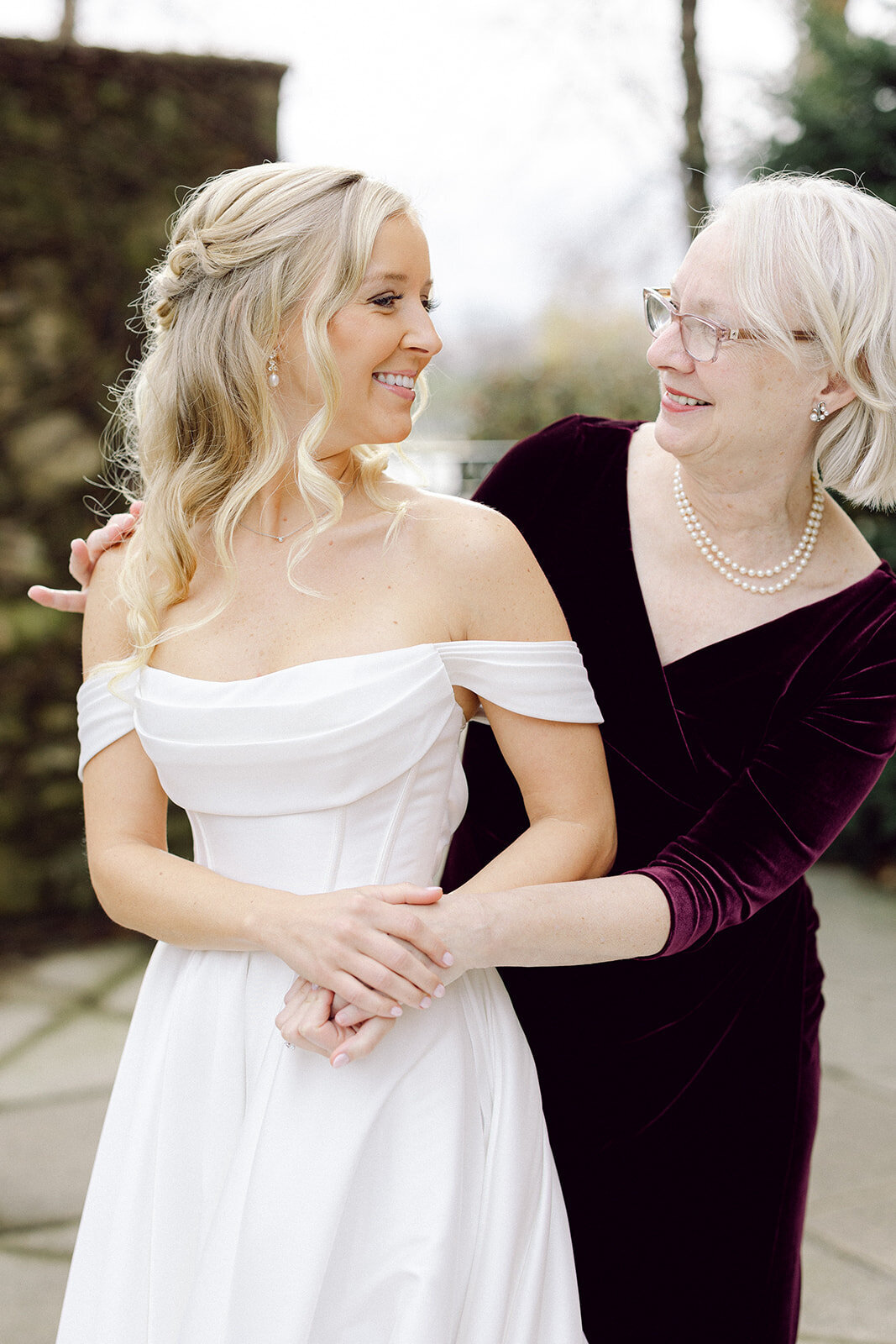 Close-up of bride and mother in Columbus venue shot by Philadelphia wedding photographer.