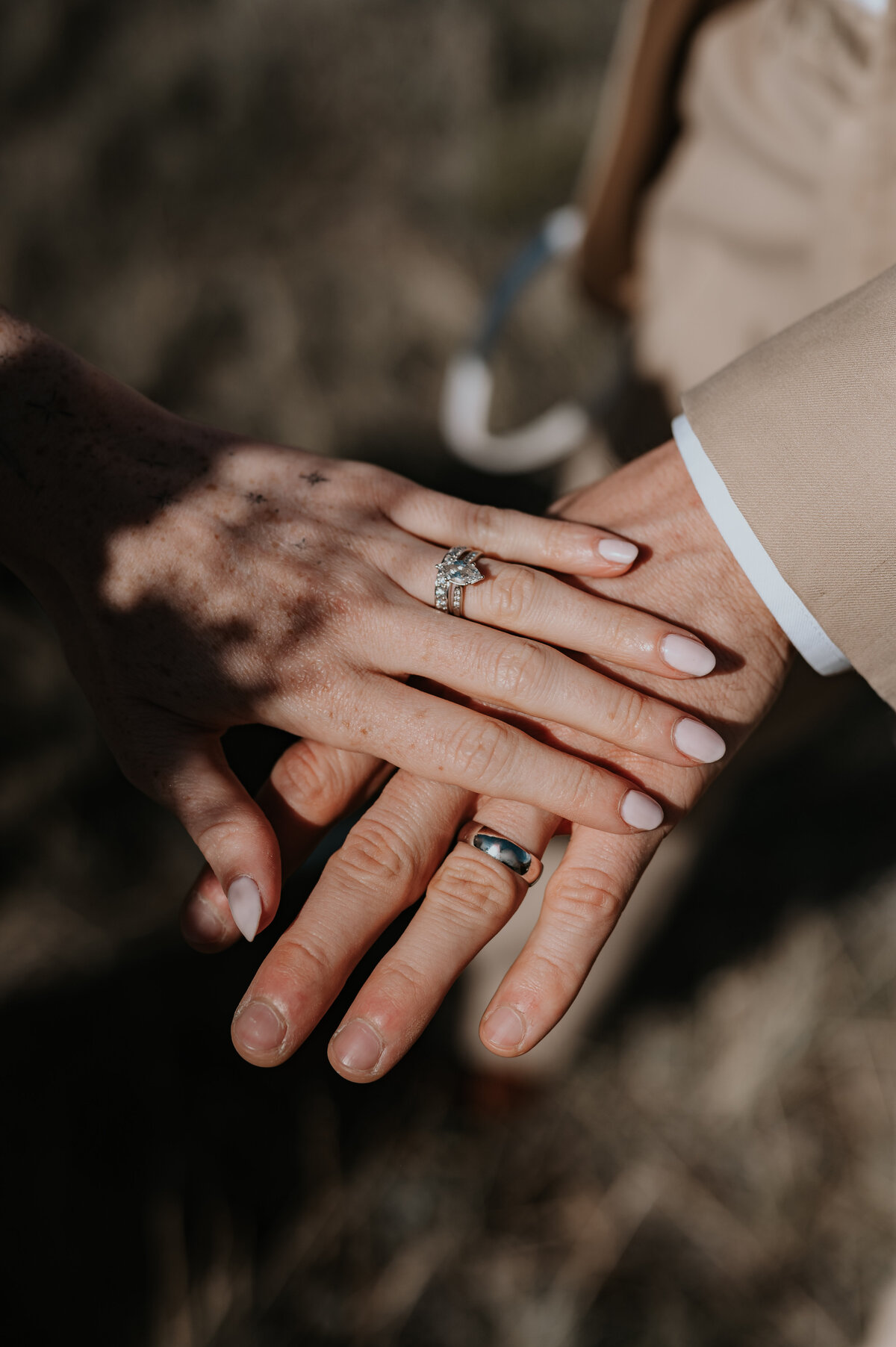 Wedding and elopement ceremony, photographer, Yellowstone, Wyoming, travel and destination, wedding, and elopement photographer wedding rings