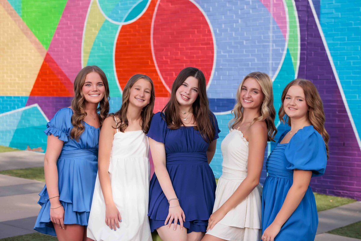 Raleigh Senior Model Team, girls wearing black with a pink backdrop.