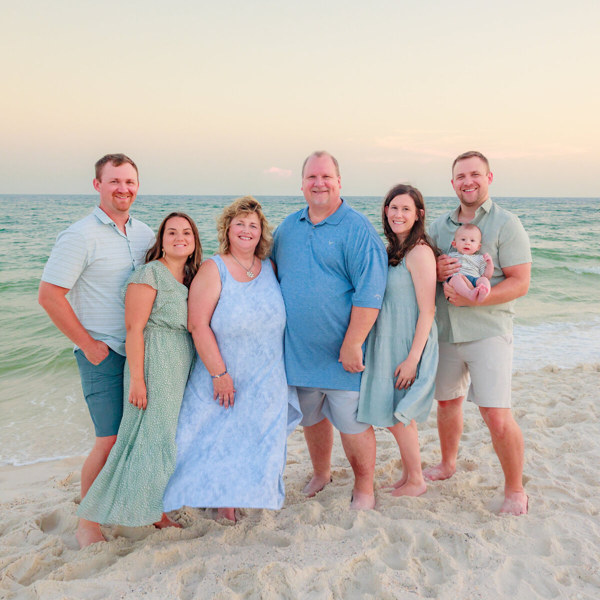 family shoreline beach photography standing in a line