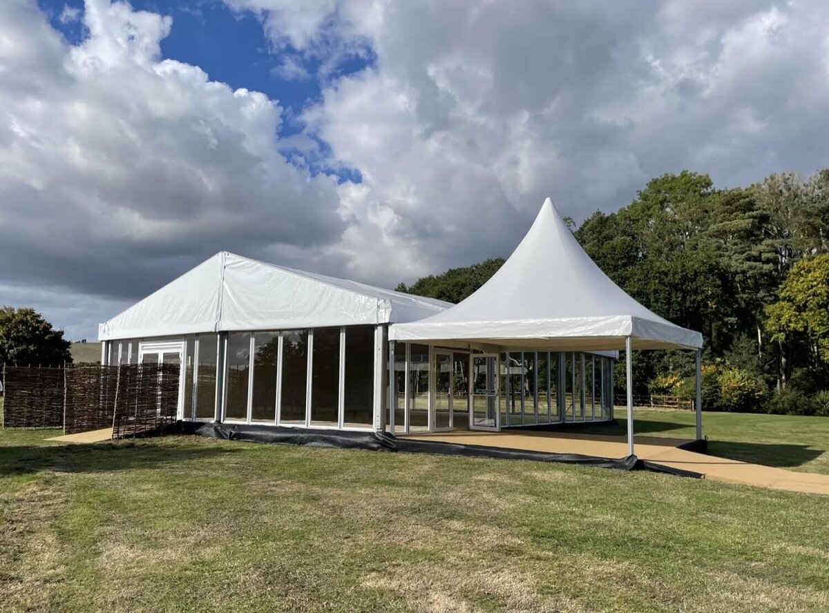 A Pagoda next to a frame marquee being used for an entrance