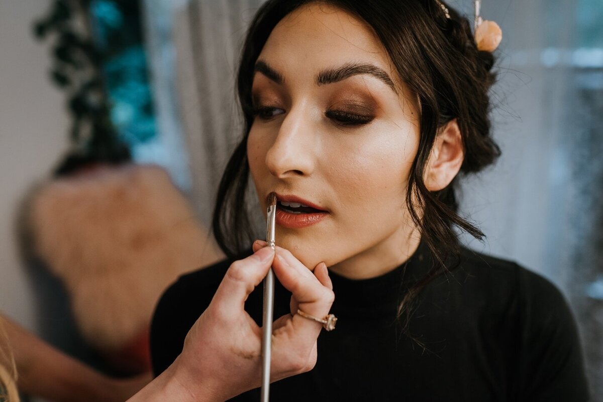 bride with makeup on face