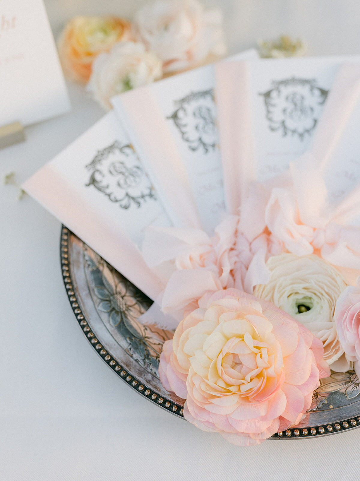 close up ceremony stationery with flowers