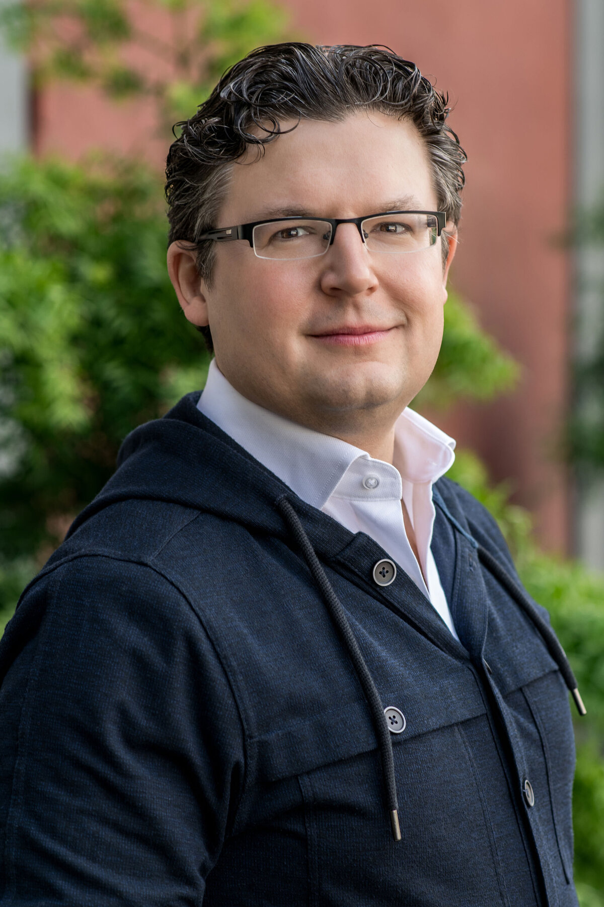 Headshot Session with Stylish Man in Blue Hoodie and Glasses by Lisa Winner Photography