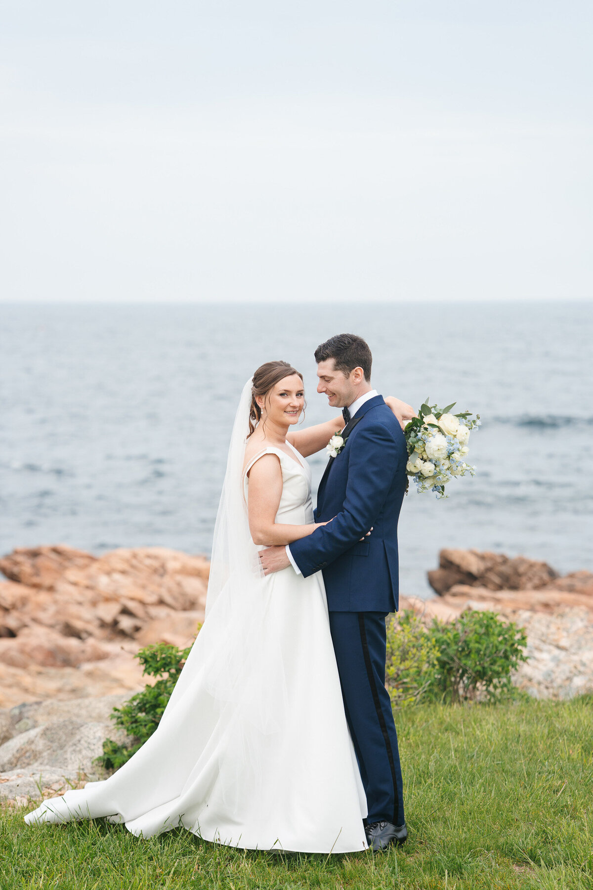 Waterfront wedding portraits at Cruiseport Gloucester with natural coastal light.