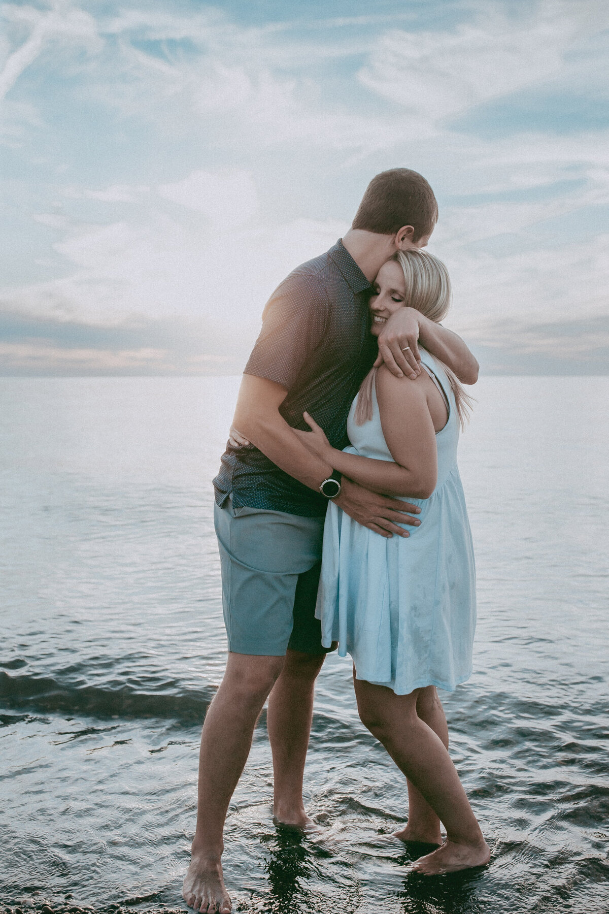 couple snuggling on the beach
