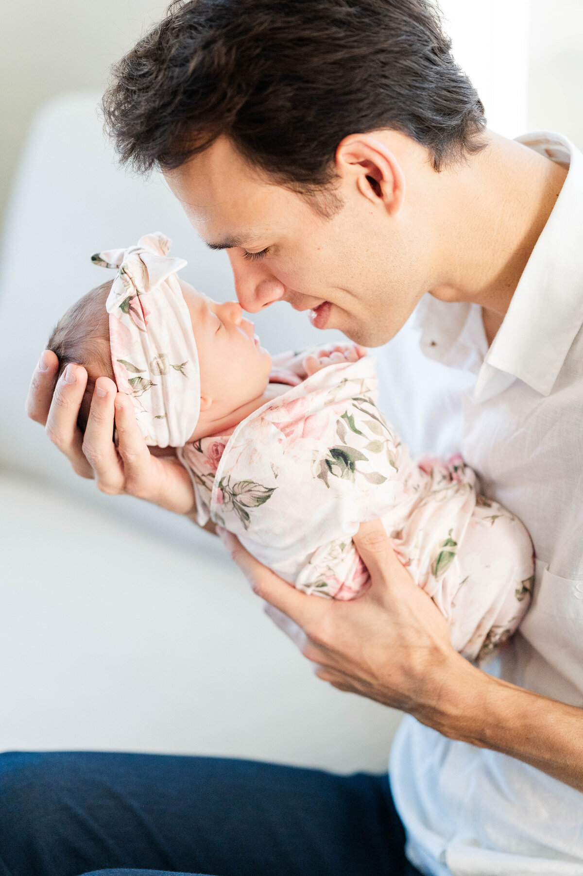 Newborn girl nose to nose with dad taken in Westwood, MA by best Westwood newborn photographer