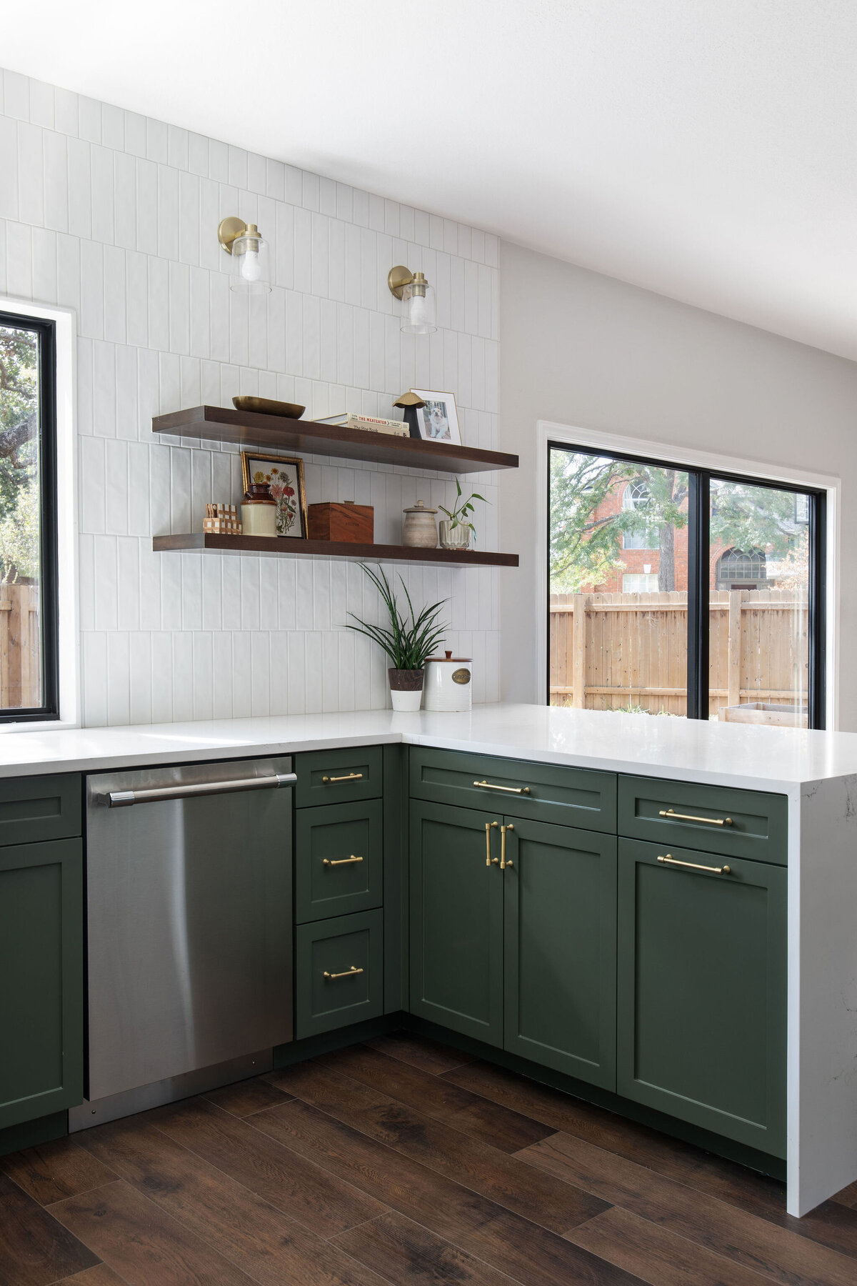 hello-home-austin-waterfall-peninsula-two-tone-kitchen-remodel-countertop-window-green-cabinets-tile-to-ceiling-9