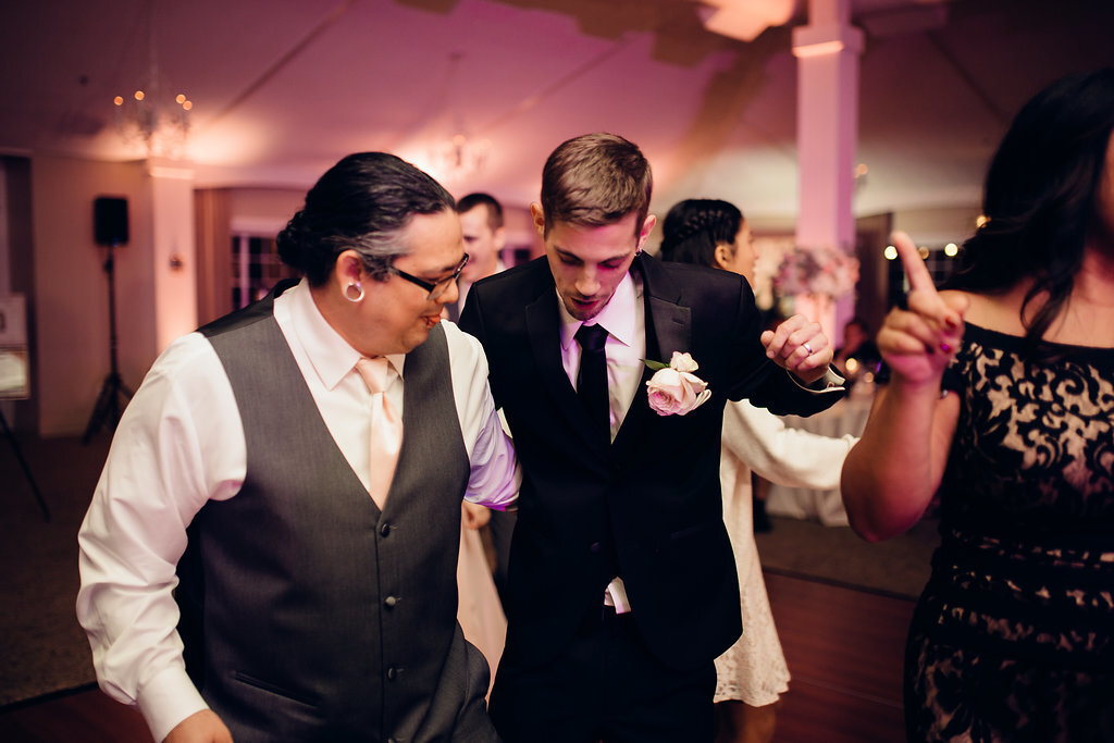 Wedding Photograph Of Groom In Black Suit And Man In gray Vest Los Angeles
