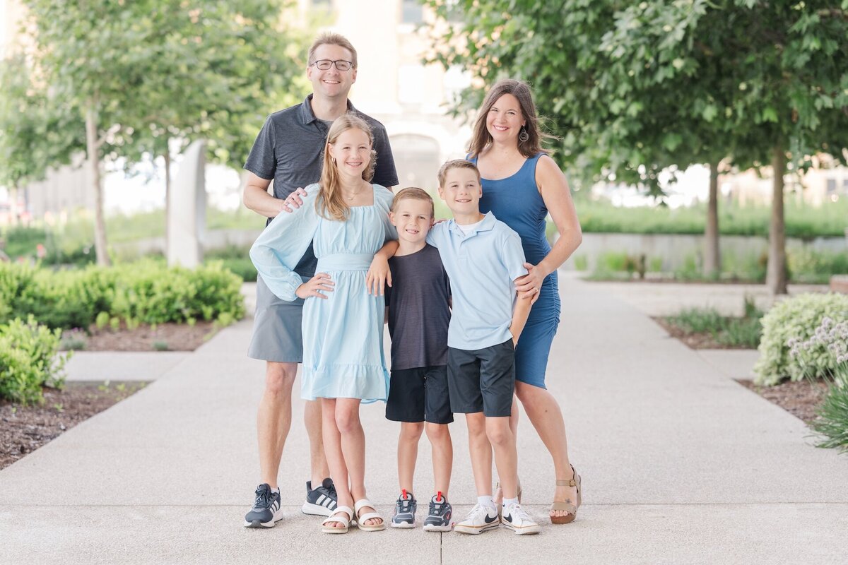 a family of five posing for a portrait