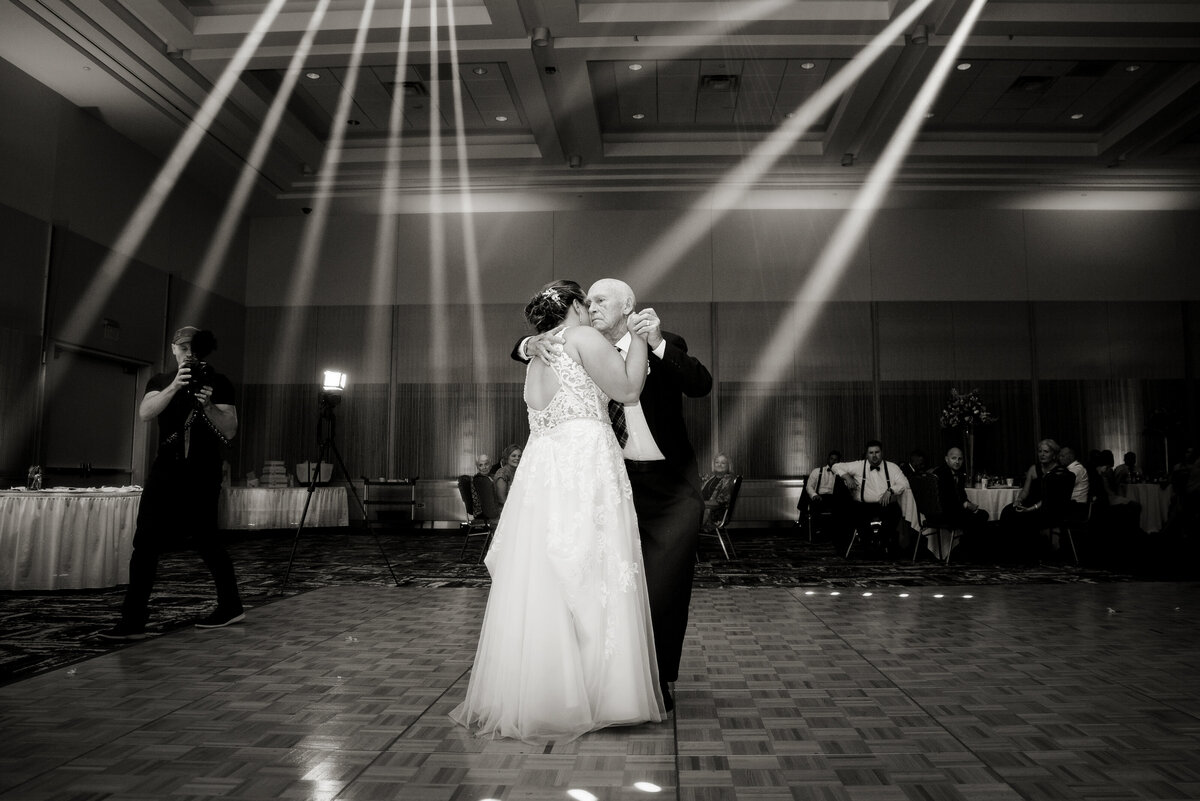 Bride dancing with grandpa during  wedding reception.