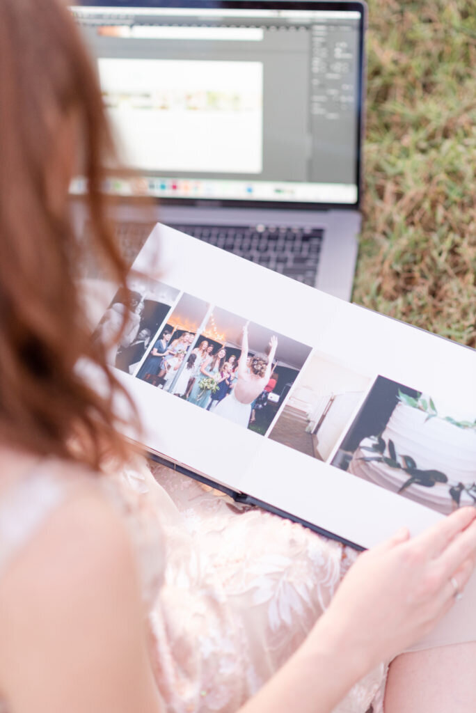 Woman looking through wedding album with photos by Nashville wedding photographer, Liz Courtney