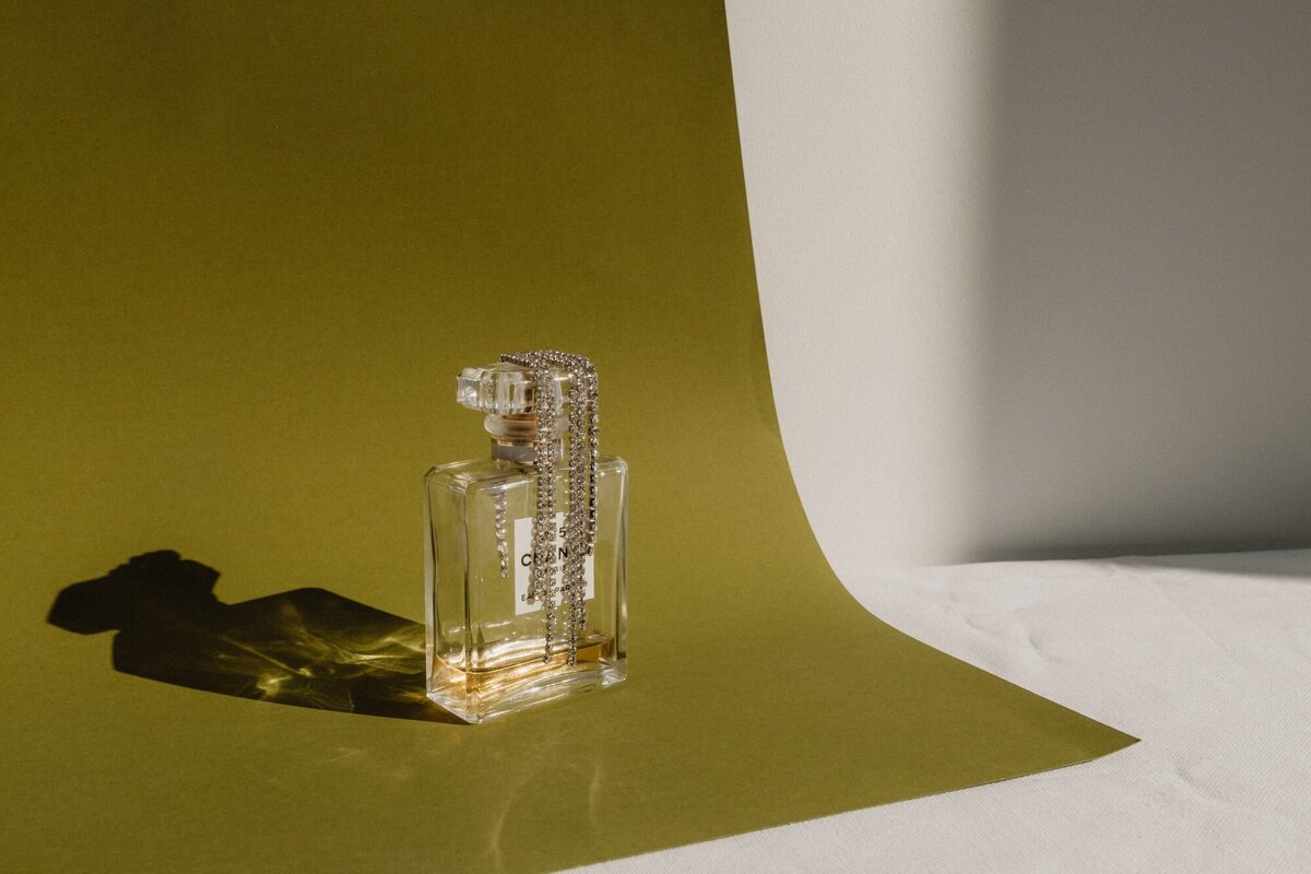 kaboompics_refined-aromas-perfume-bottles-cast-in-shadows-and-light-35444
