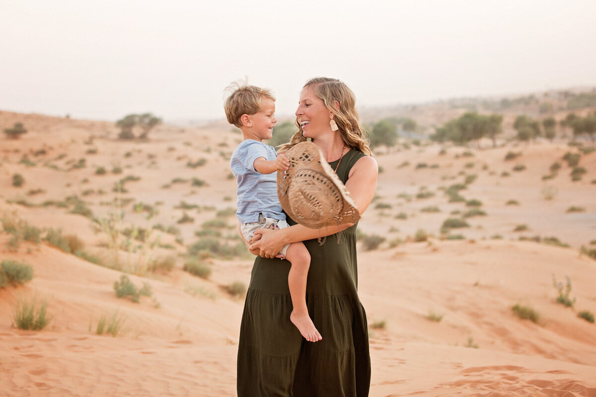 son-on-mamas-lap-in-desert