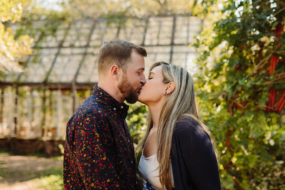 Austin proposal planning engaged couple kissing